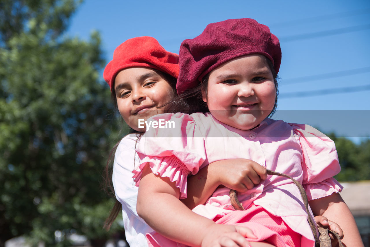 Argentinian little sisters wearing traditional clothing