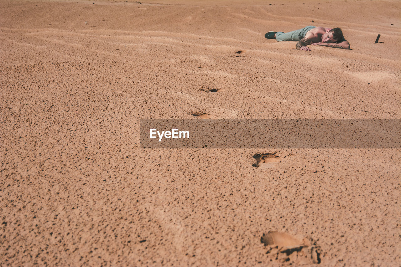 land, sand, soil, natural environment, nature, beach, day, erg, desert, high angle view, landscape, scenics - nature, environment, brown, sunlight, outdoors, tranquility, no people, wadi, climate, beauty in nature, travel, tranquil scene