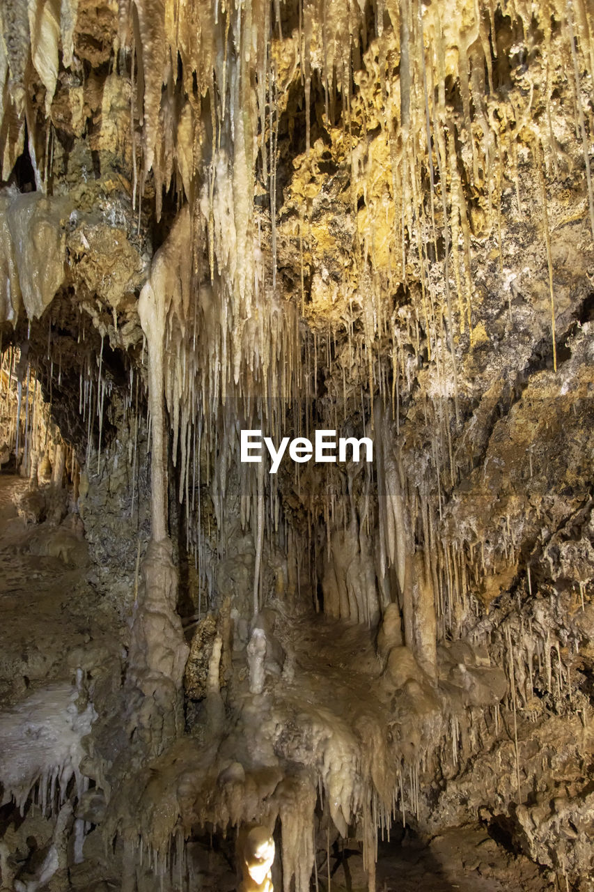 LOW ANGLE VIEW OF CAVE IN WATER