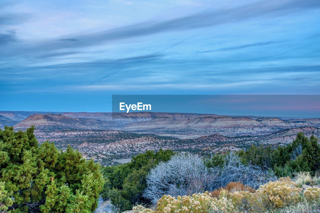 SCENIC VIEW OF LANDSCAPE AND MOUNTAINS AGAINST SKY
