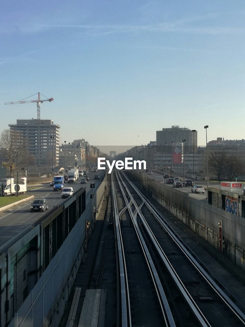 HIGH ANGLE VIEW OF RAILROAD TRACKS AGAINST SKY