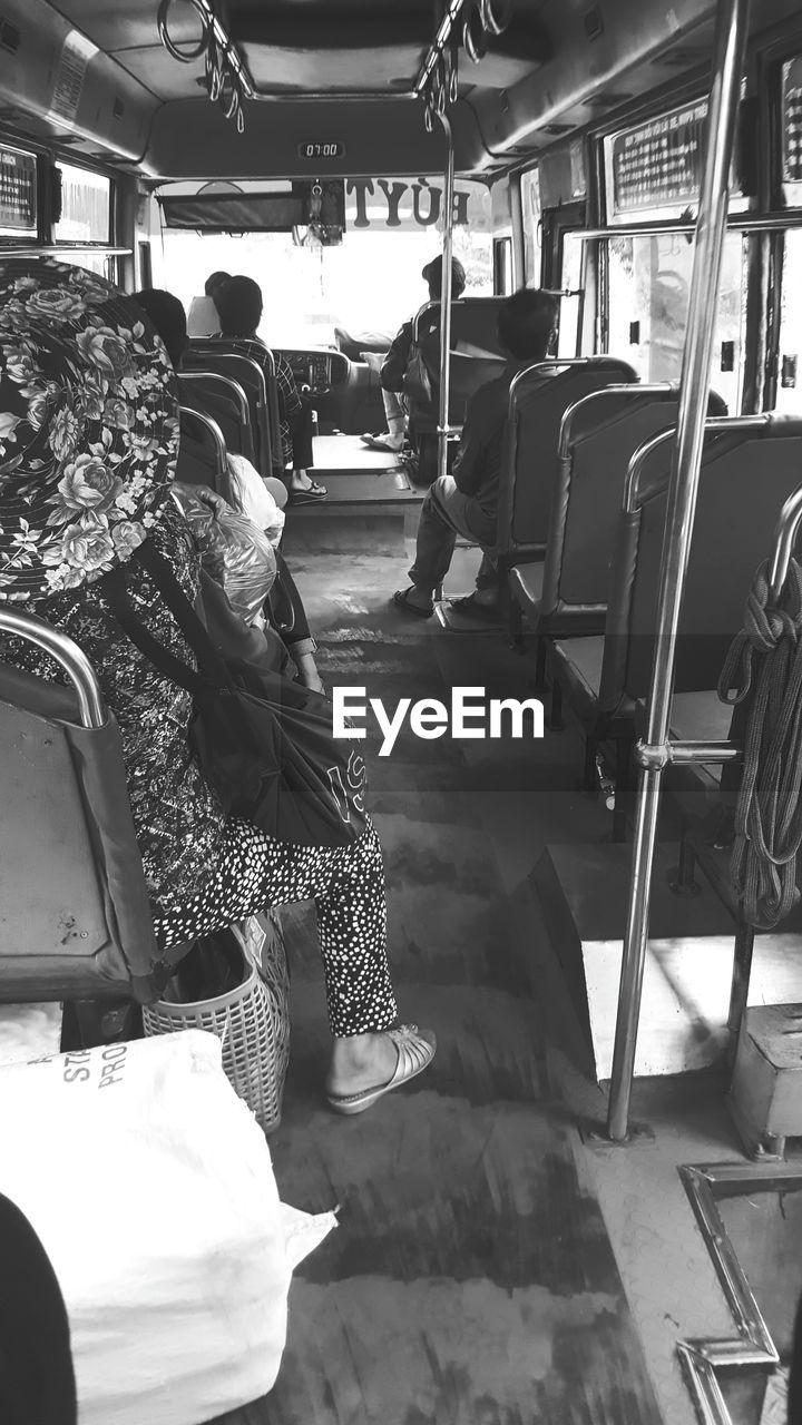 REAR VIEW OF PEOPLE IN BUS