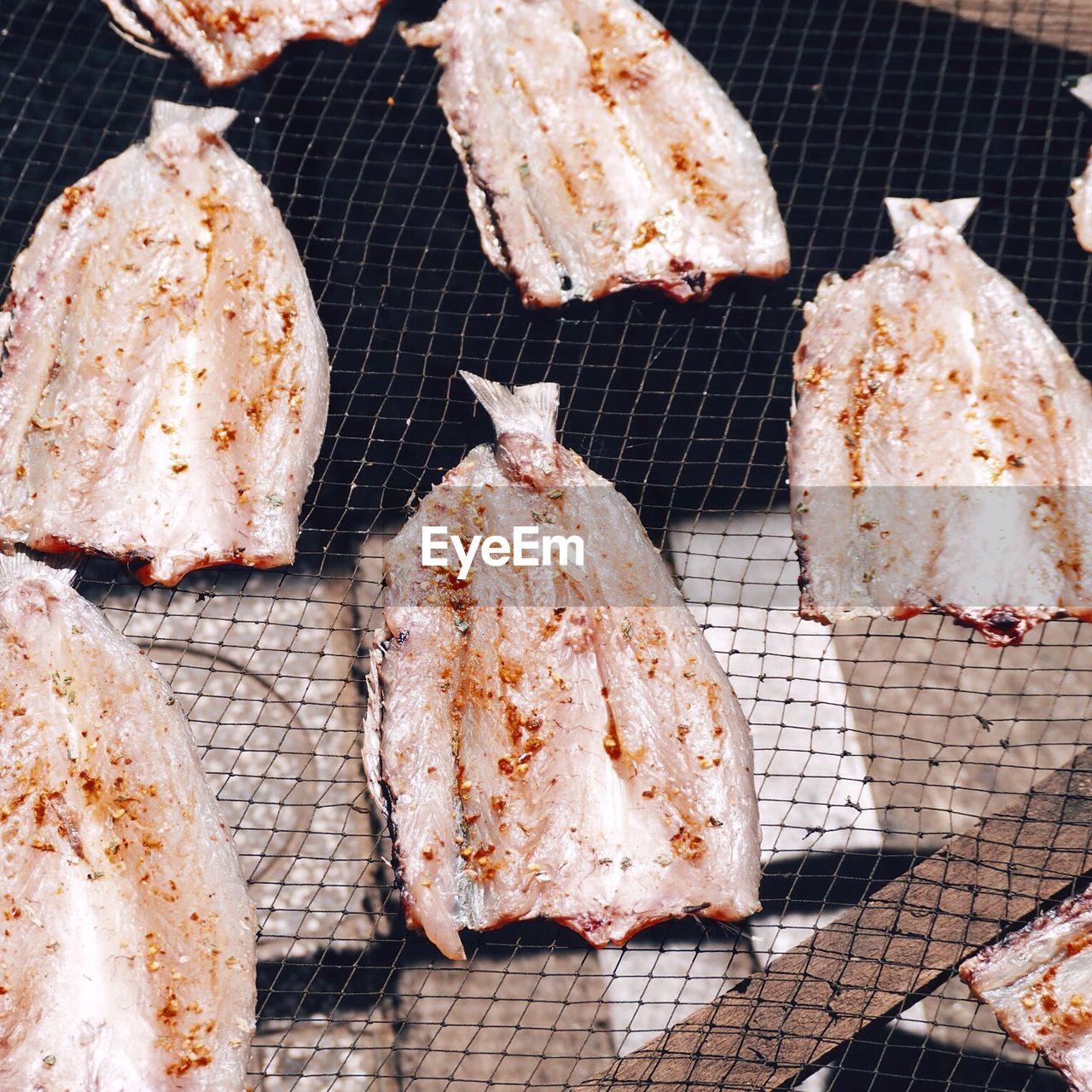 High angle view of meat on barbecue grill