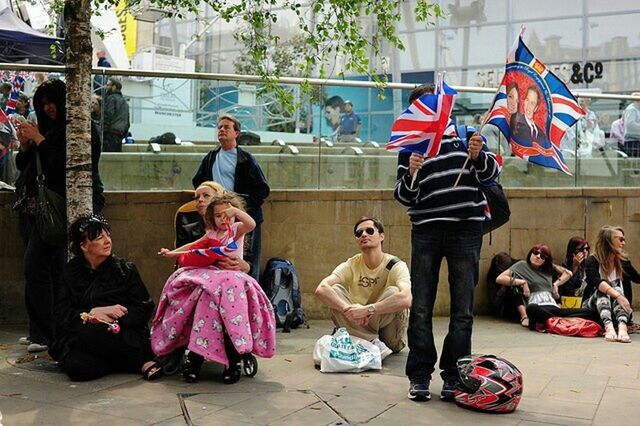 PEOPLE SITTING ON BENCH