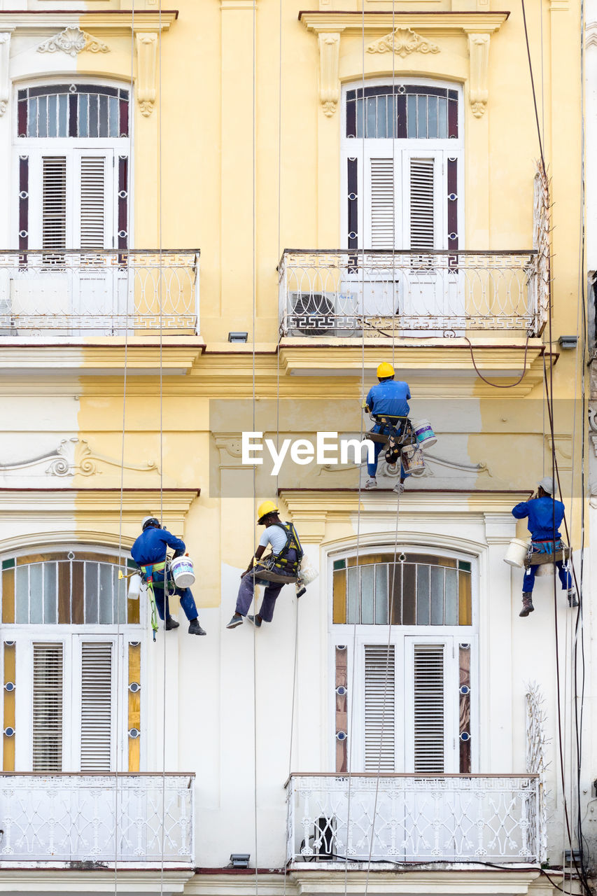 PEOPLE WORKING ON BUILDING