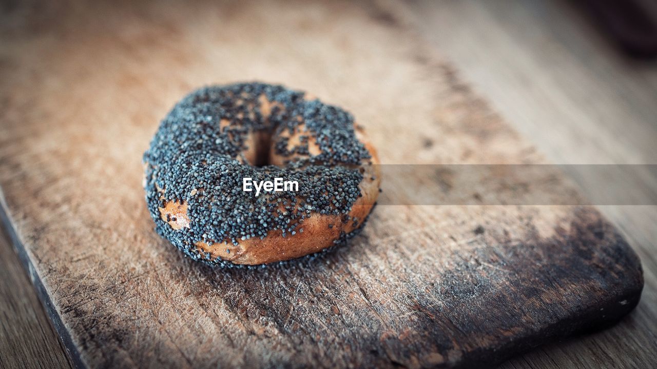 Close-up of bagel on cutting board