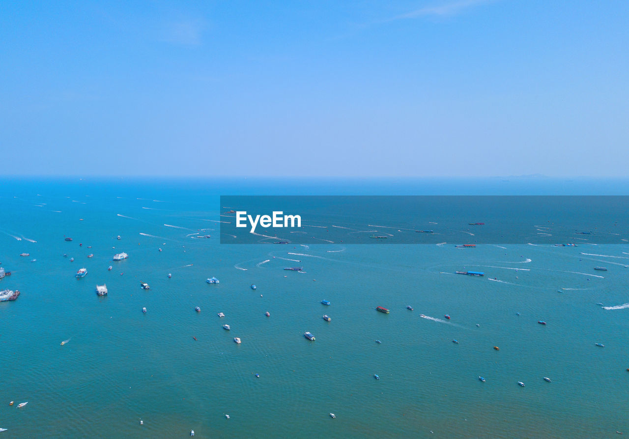 HIGH ANGLE VIEW OF SEA AGAINST CLEAR SKY