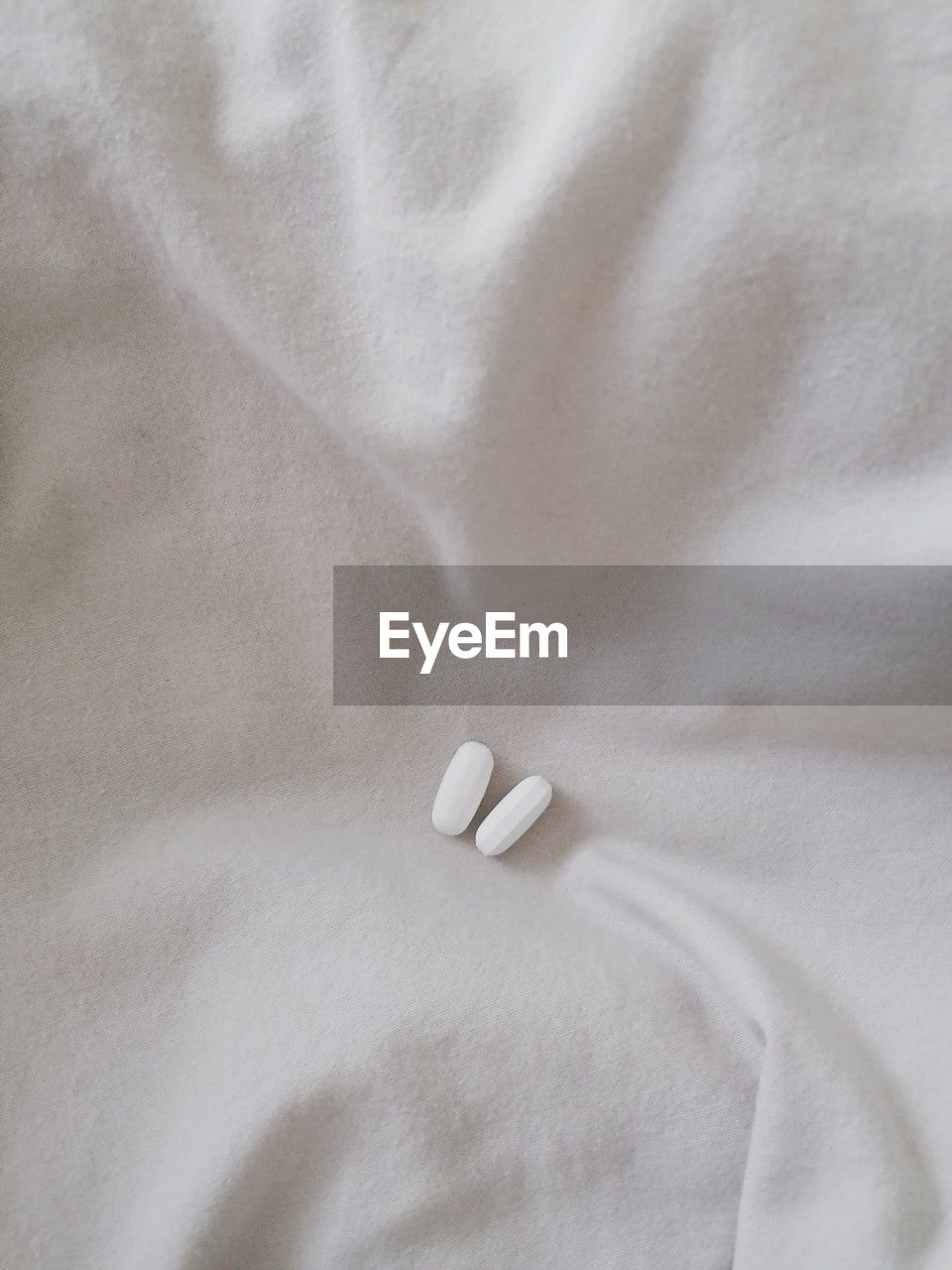 Close-up of pills on bed