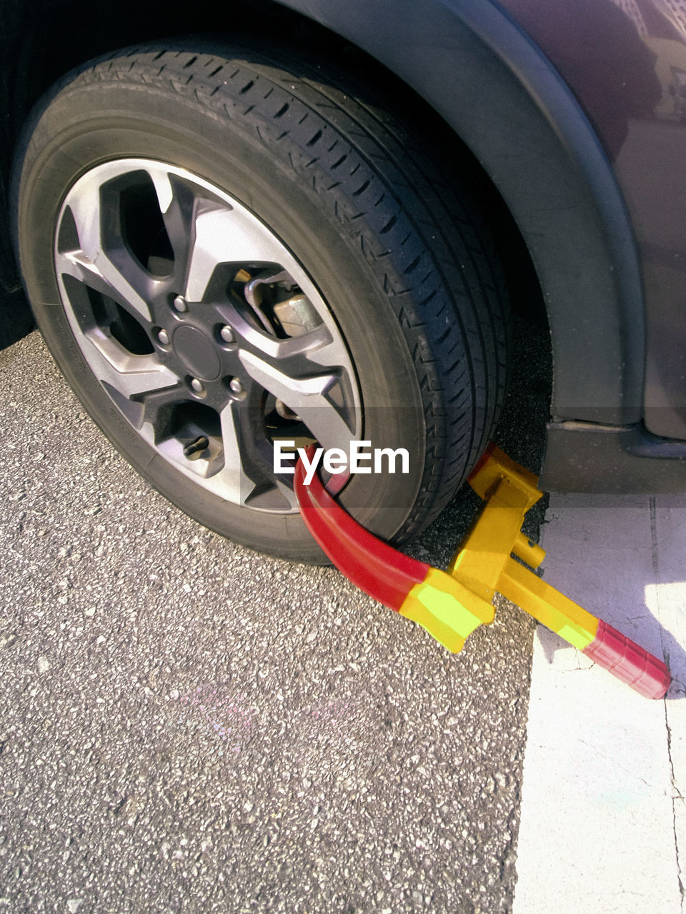 Close-up of clamped car wheel 