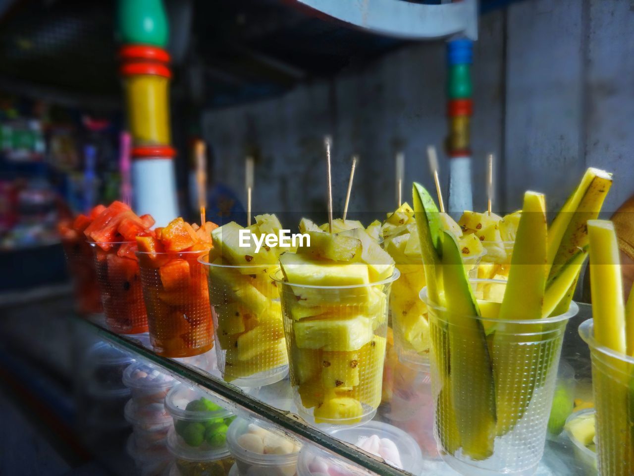 Close-up of fruits in glass on table, fresh vegetables fruit