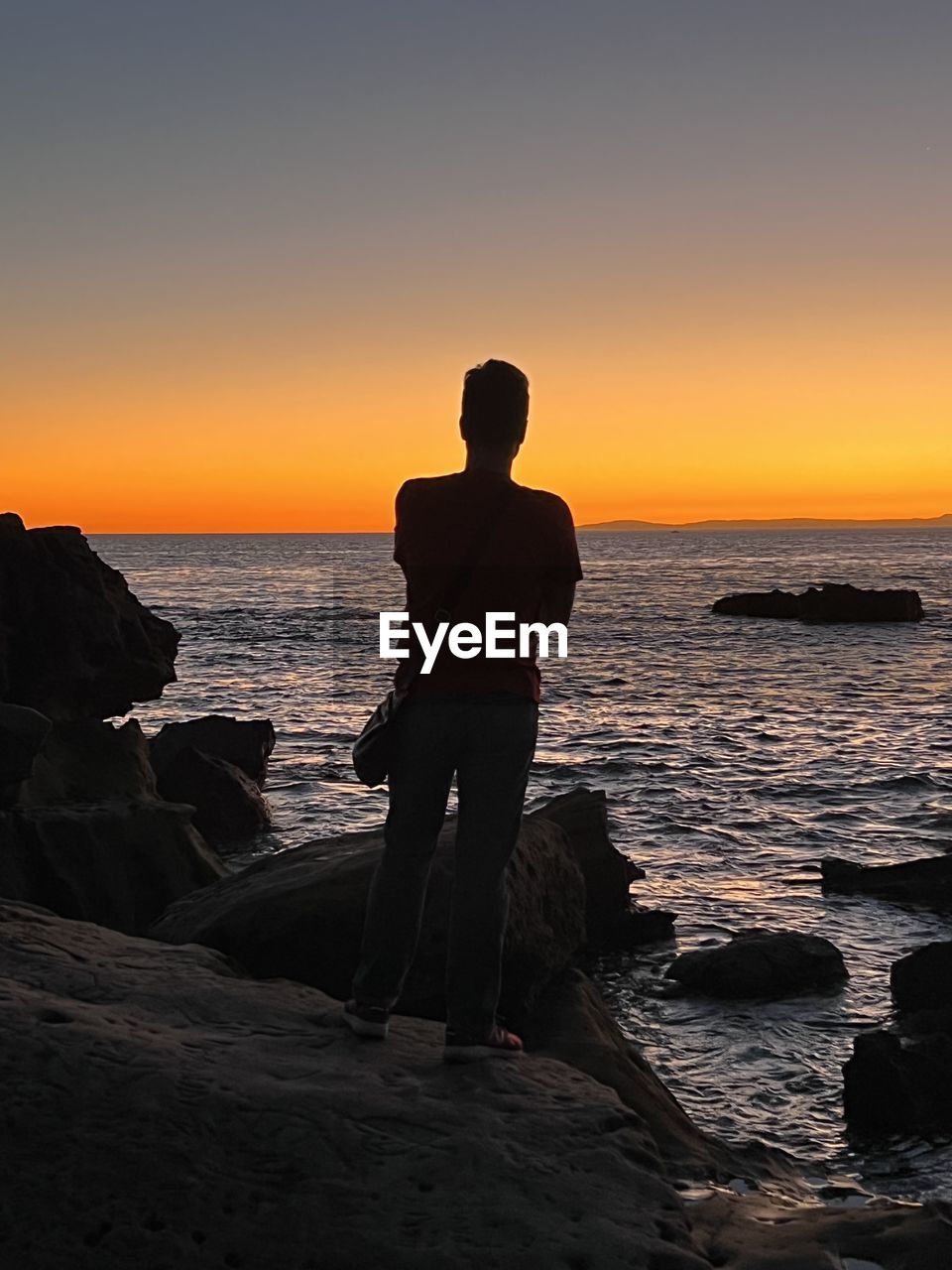 darkness, nature, rock, one person, silhouette, light, sunset, outdoors, orange color, sports, sky