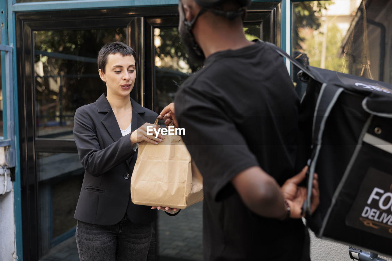 portrait of young woman using mobile phone