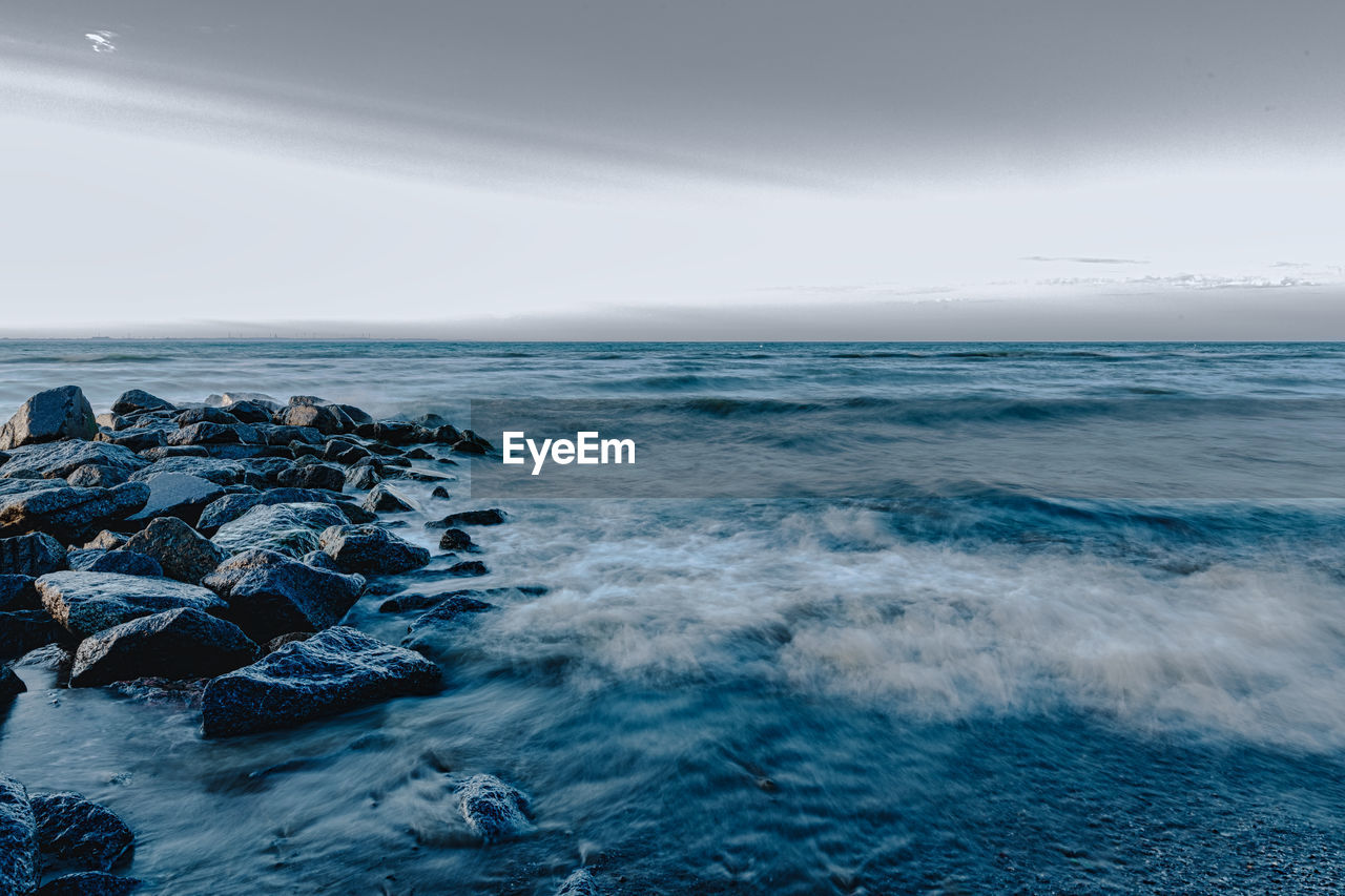 scenic view of sea against clear blue sky