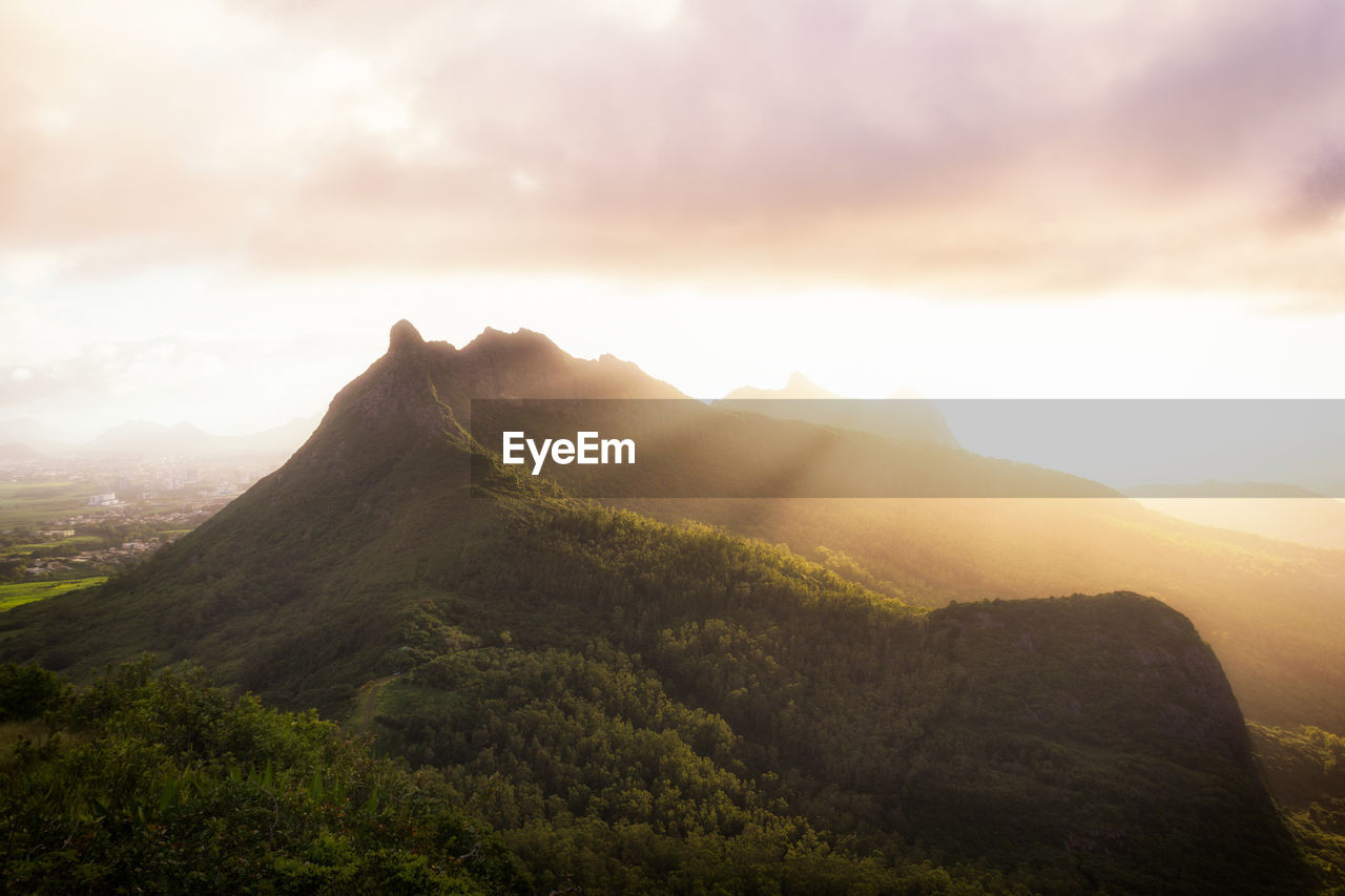 Scenic view of mountains against sky during sunset