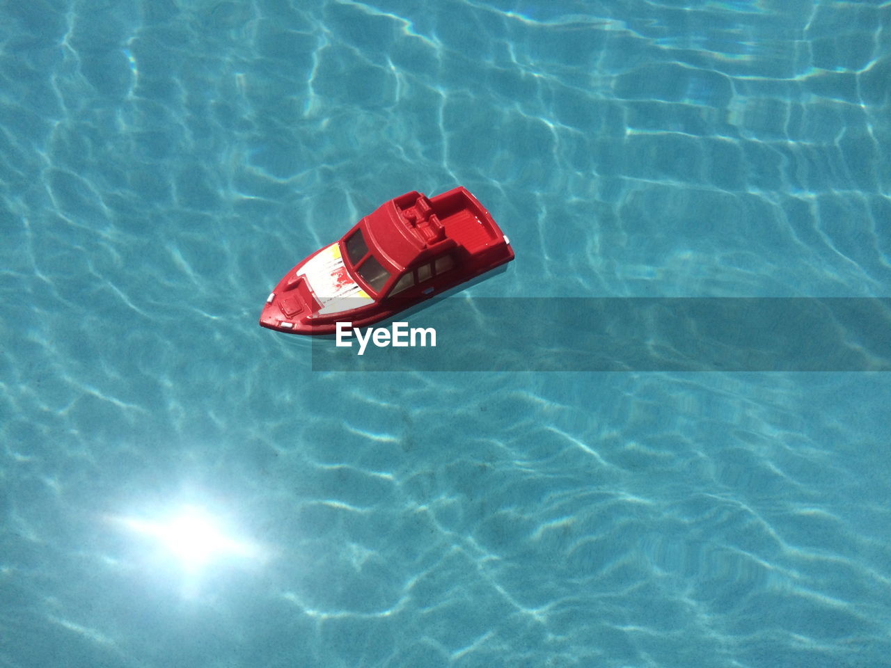 High angle view of toy floating on swimming pool