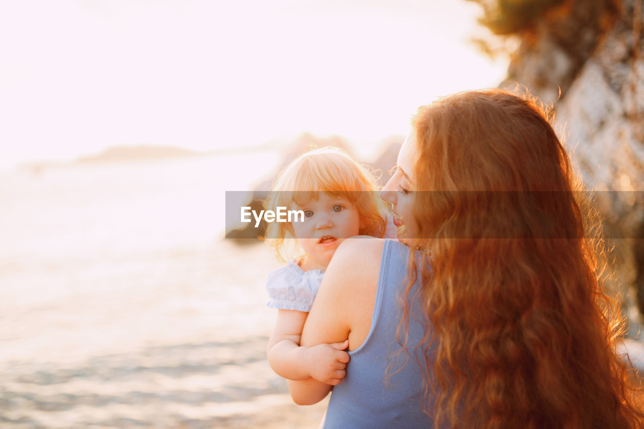 MOTHER AND SON ON BEACH