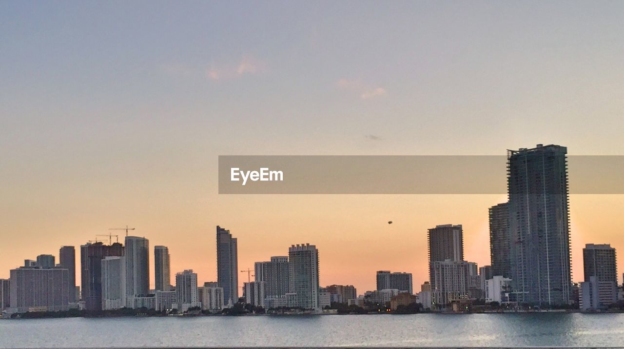 VIEW OF SKYSCRAPERS IN CITY AGAINST SKY