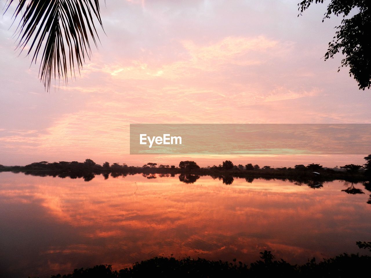 Scenic view of landscape against sky during sunset