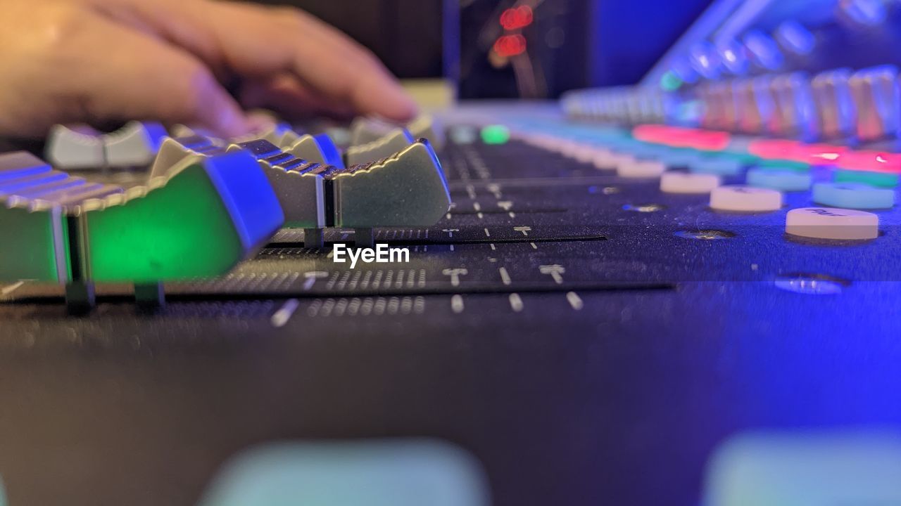 cropped hand of man using computer keyboard