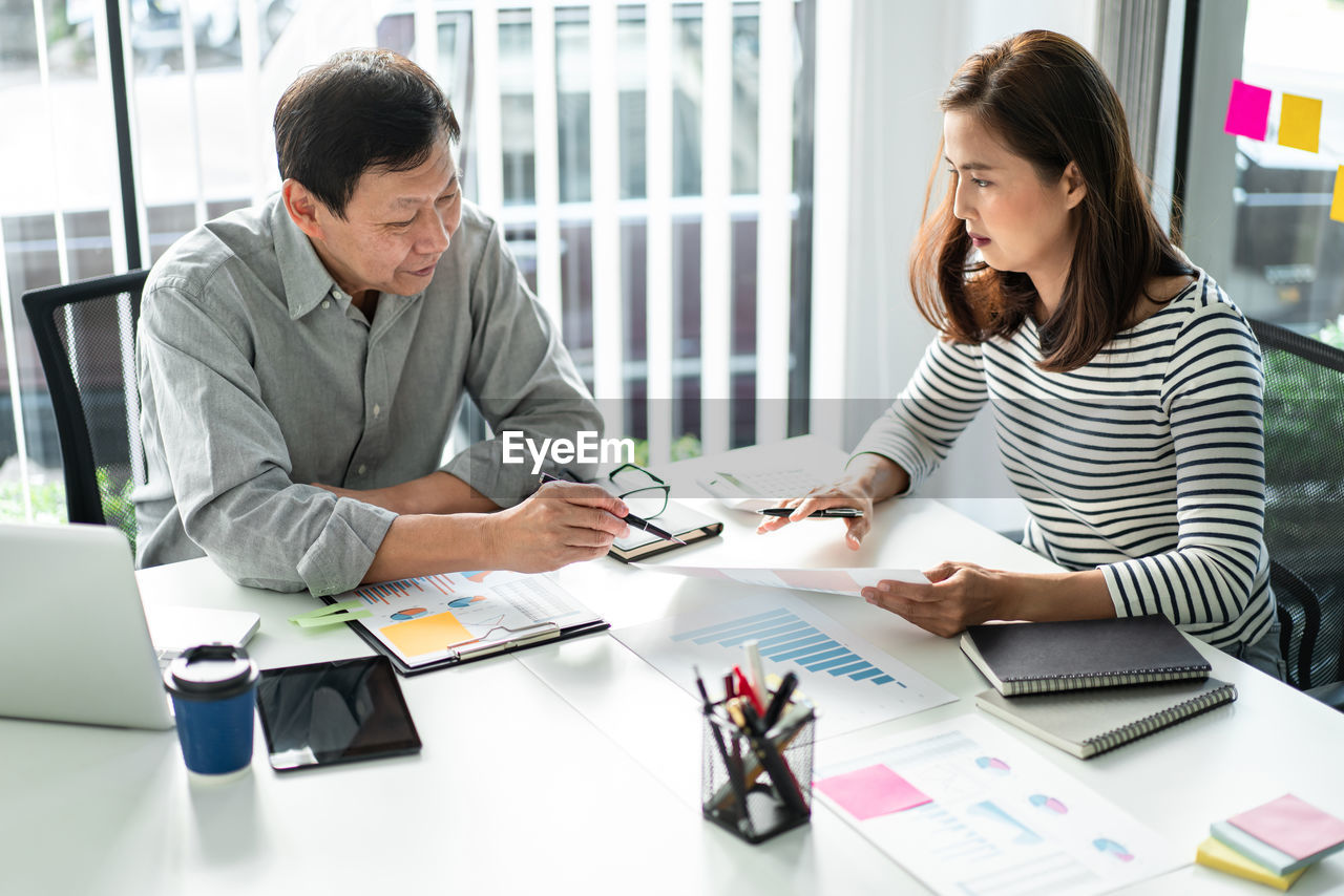 Business colleagues having discussion at office