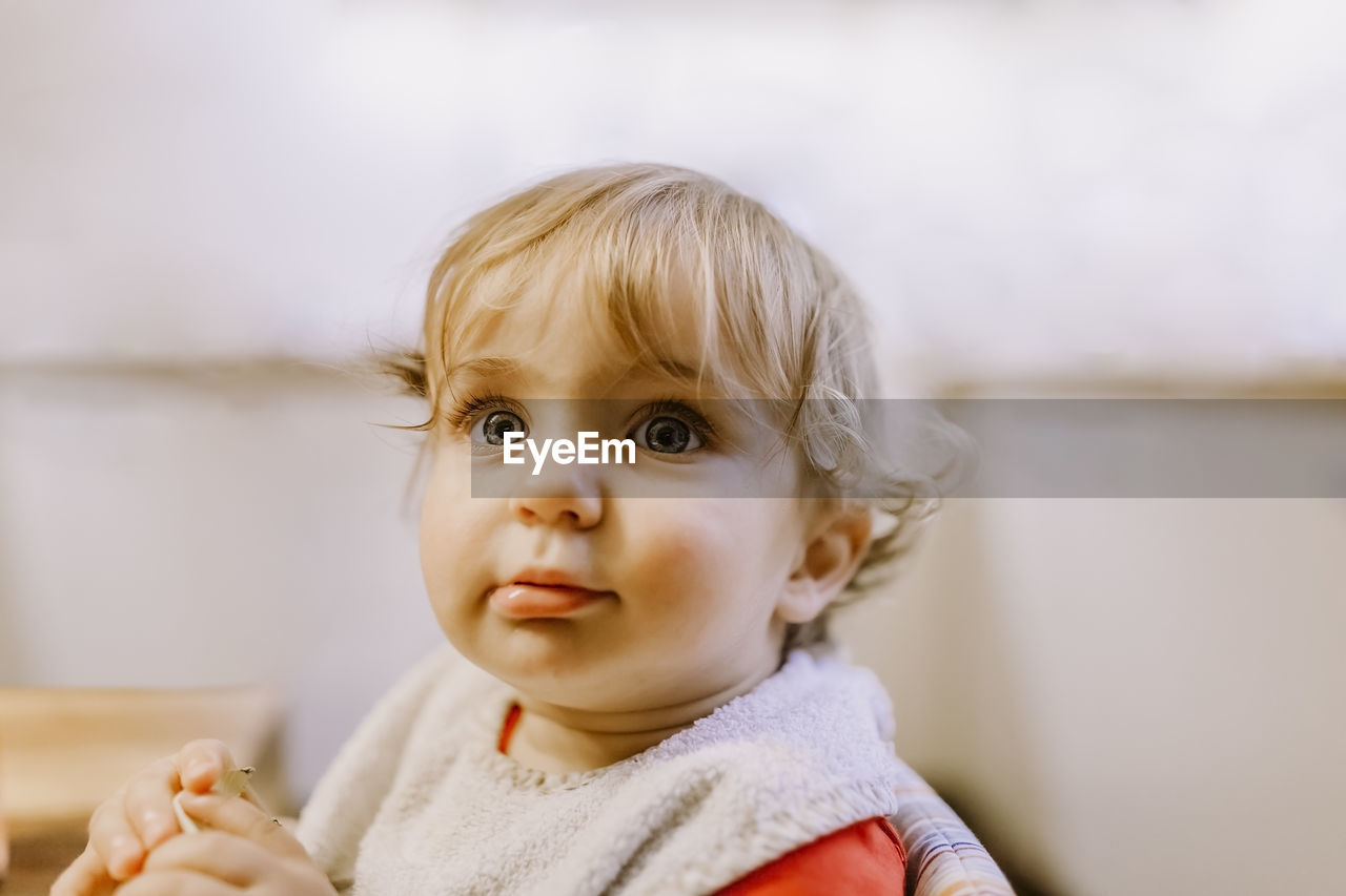 Portrait of cute baby girl at home