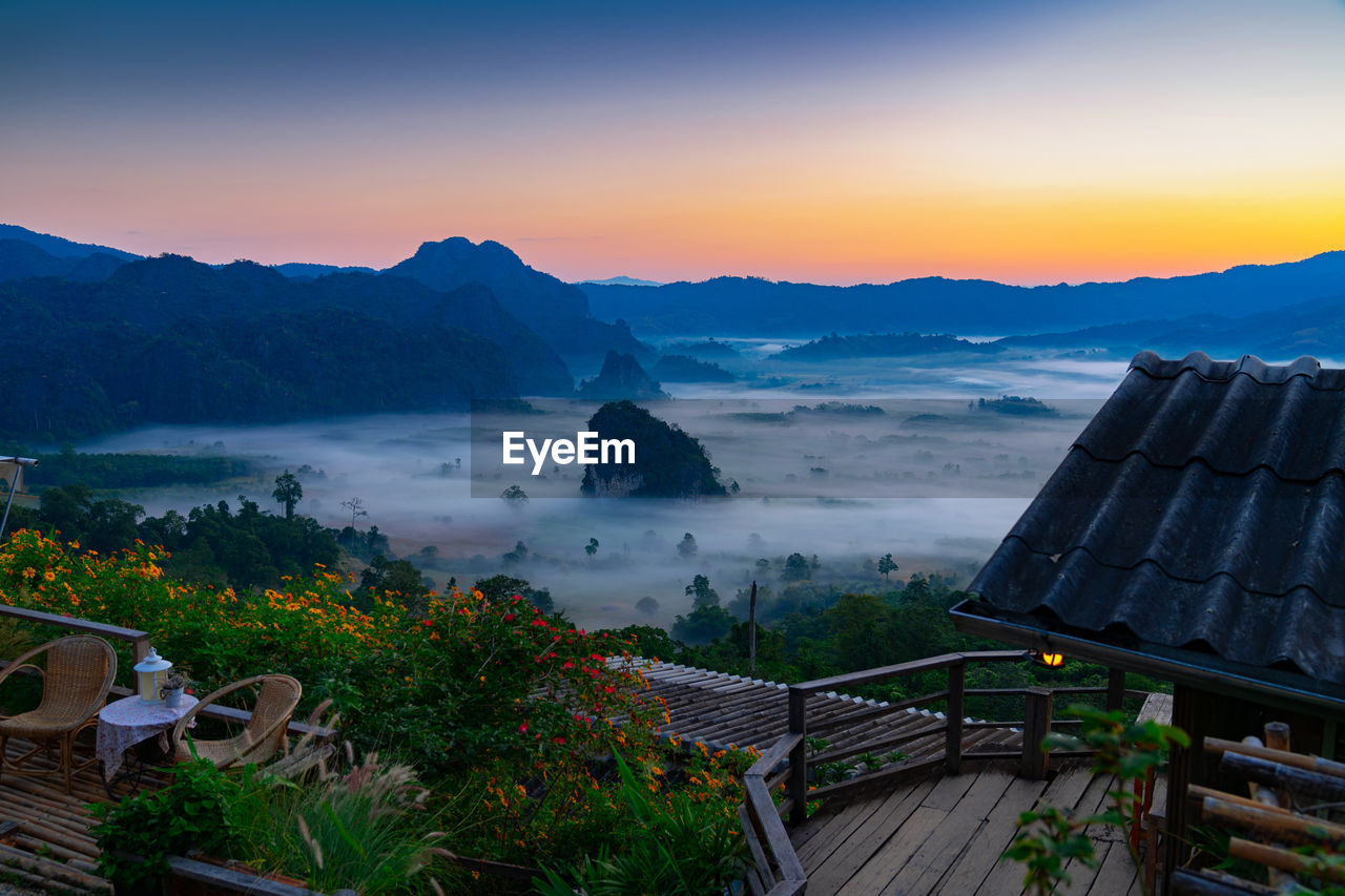 Sunrise and morning mist at pha chang noi viewpoint, phu langka national park, phayao , thailand.