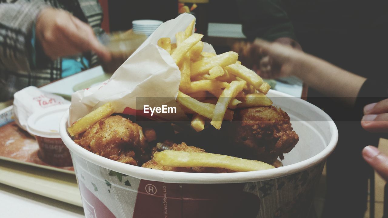 Close-up of french fries with meat served on table