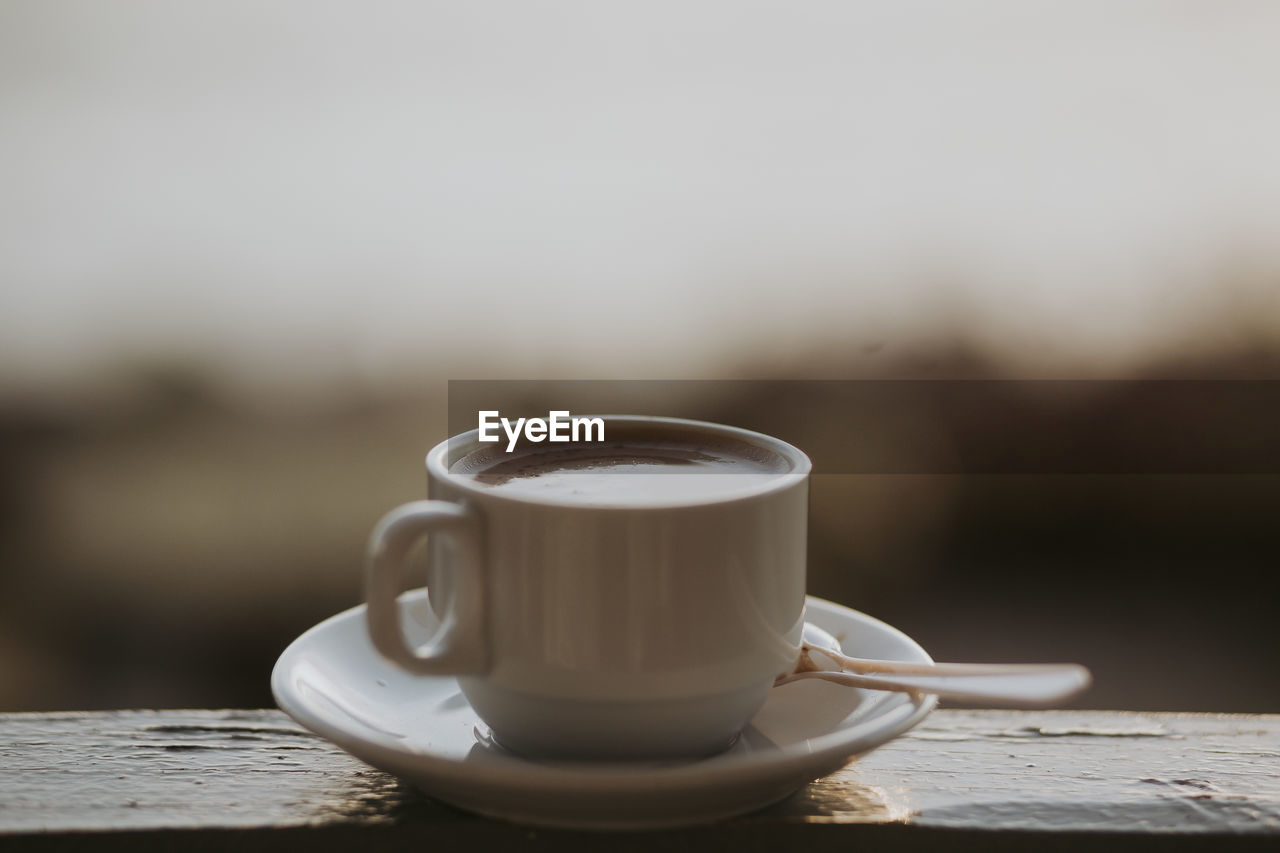 Close-up of coffee cup on table