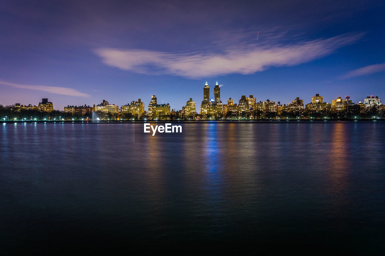 Illuminated buildings against sky