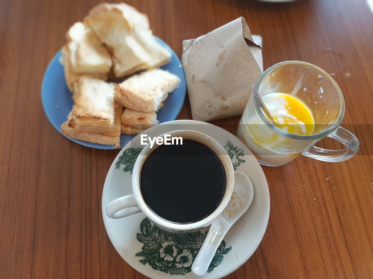 High angle view of breakfast on wooden table