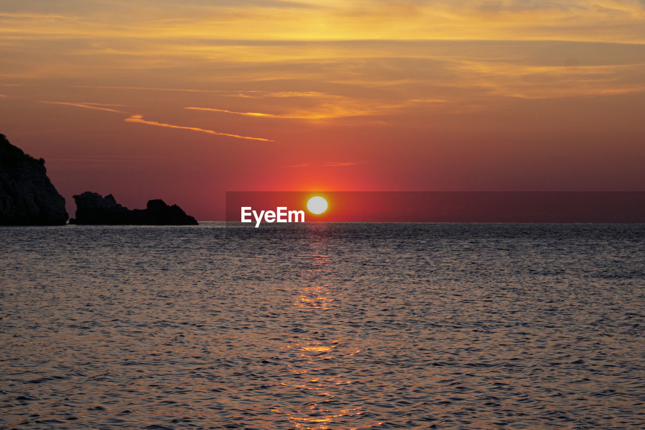 SCENIC VIEW OF SEA DURING SUNSET