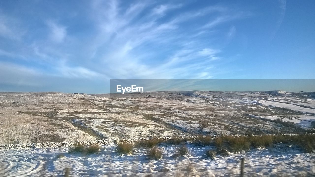 PANORAMIC VIEW OF SEA AGAINST BLUE SKY