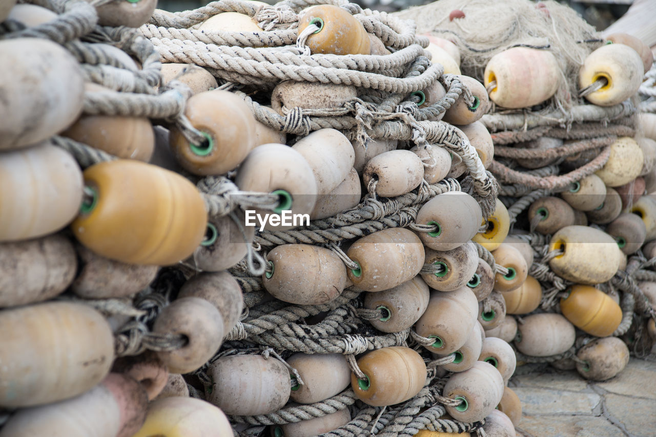 Close-up of ropes and buoys