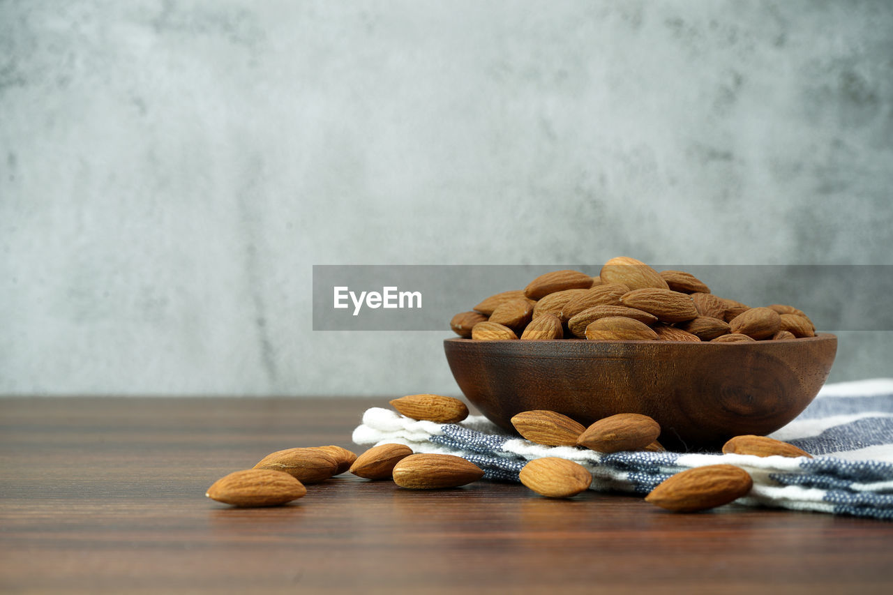 food and drink, food, nuts & seeds, wellbeing, nut, healthy eating, nut - food, indoors, freshness, table, no people, produce, wood, still life, copy space, studio shot, bowl, walnut, plant, almond, ingredient, fruit, snack