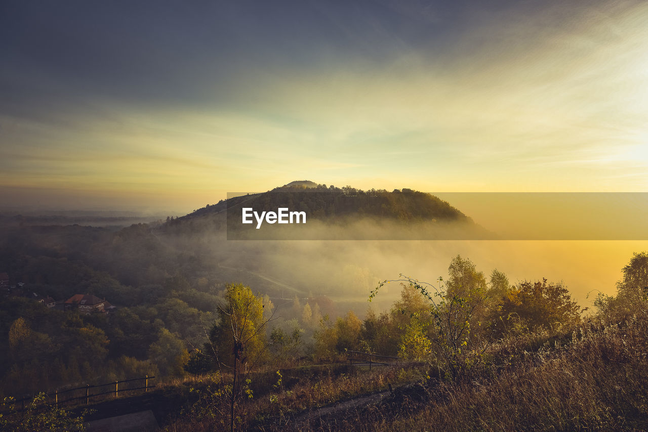 Scenic view of landscape against sky during sunset