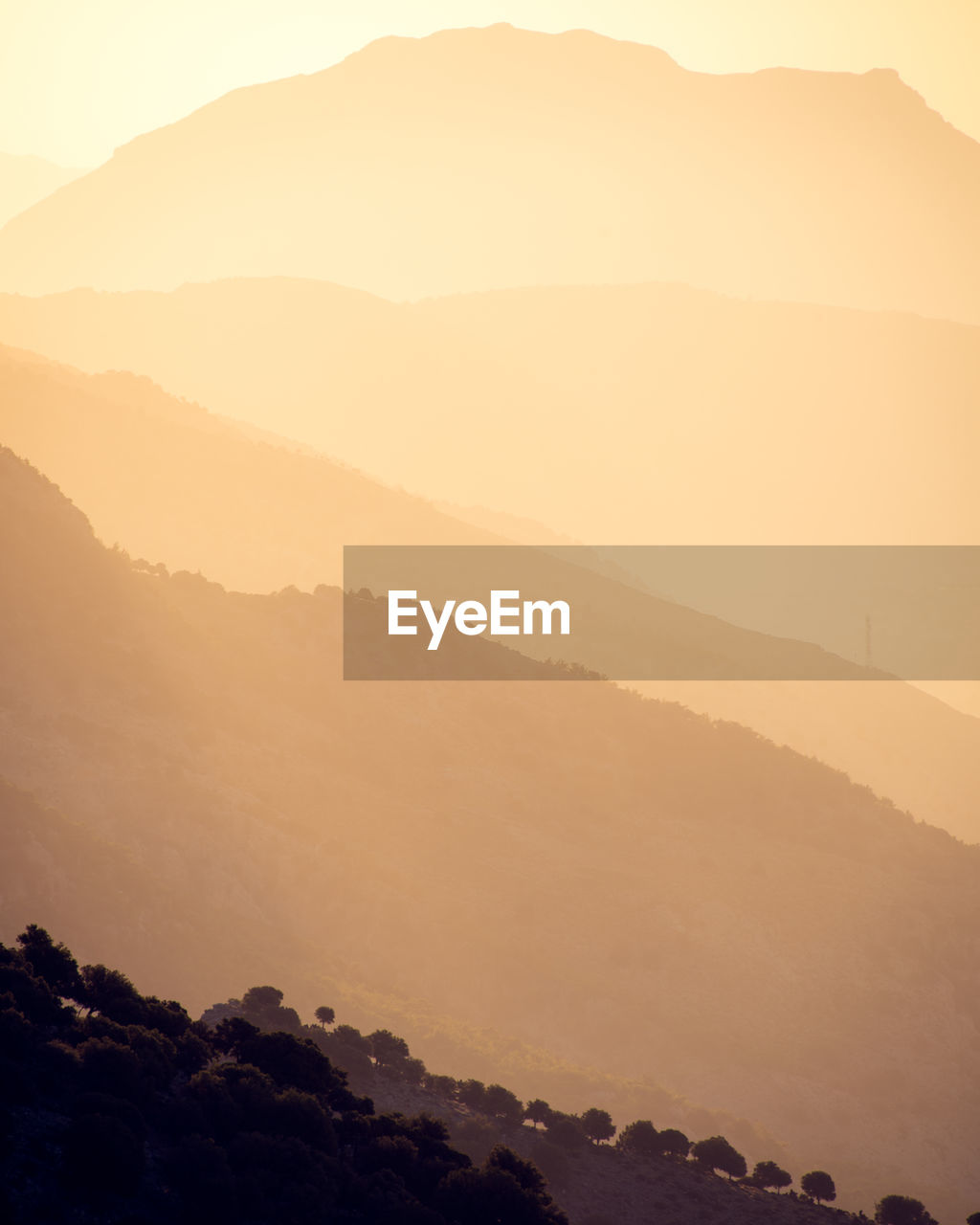 Scenic view of mountains against sky during sunset