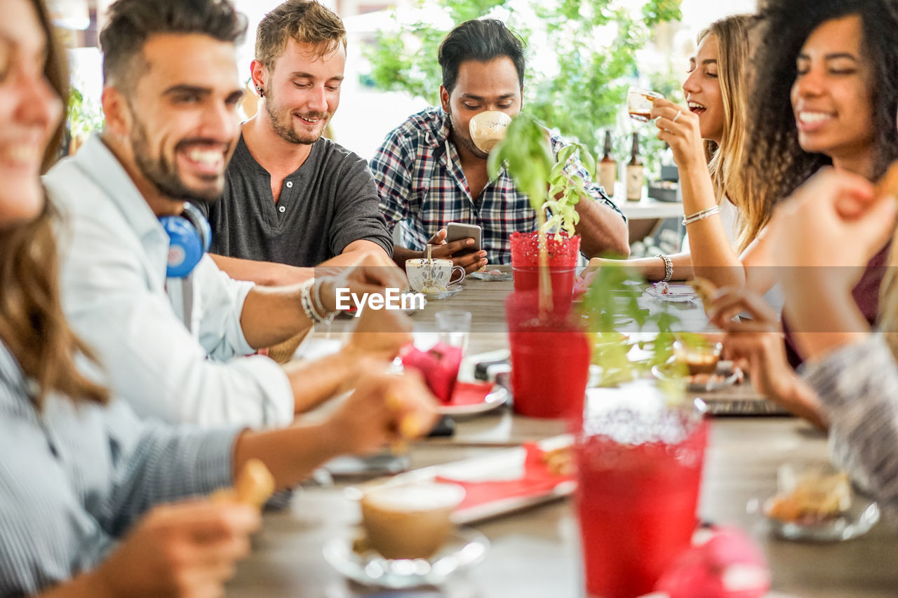 Happy having food at table