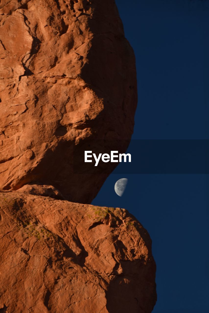 LOW ANGLE VIEW OF ROCK FORMATIONS AGAINST SKY