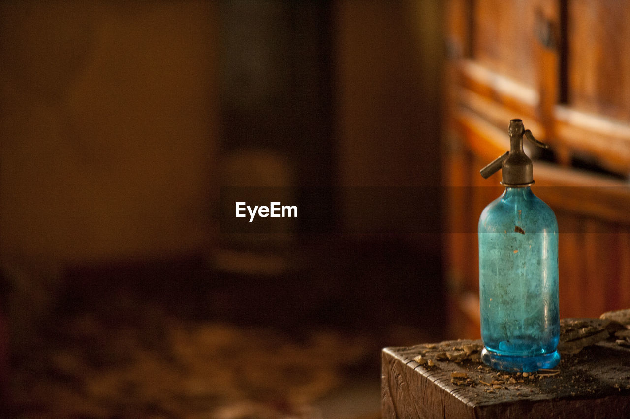 Close-up of spray bottle on table