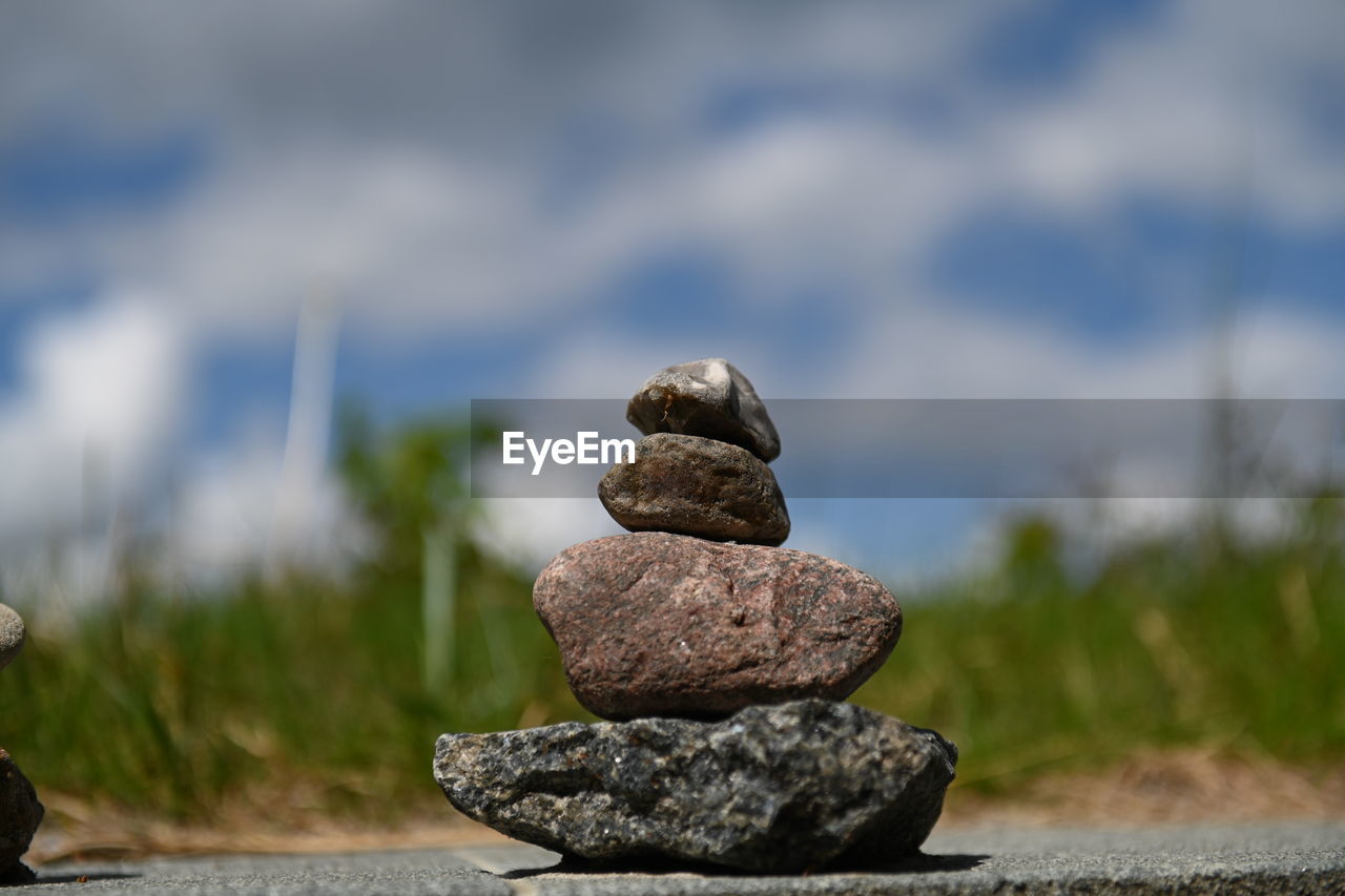 rock, balance, zen-like, nature, stone, no people, sky, focus on foreground, day, cloud, pebble, tranquility, outdoors, land, beauty in nature, water, close-up, selective focus, sea