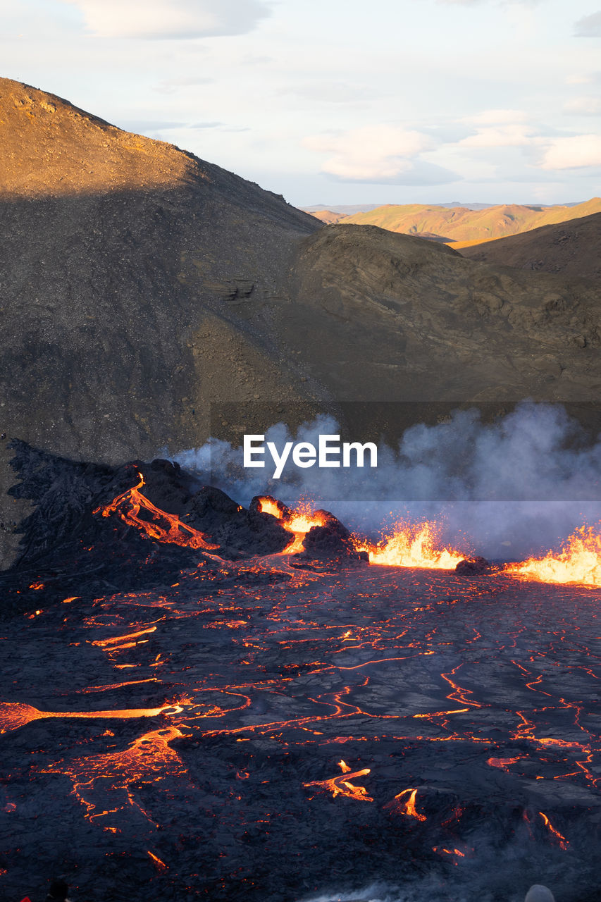 volcano, mountain, geology, lava, environment, heat, landscape, land, nature, smoke, volcanic landscape, erupting, no people, power in nature, beauty in nature, active volcano, burning, non-urban scene, physical geography, island, outdoors, volcanic crater, fire, sign, scenics - nature, volcanic activity, extreme terrain, accidents and disasters, day, rock, cloud, sky