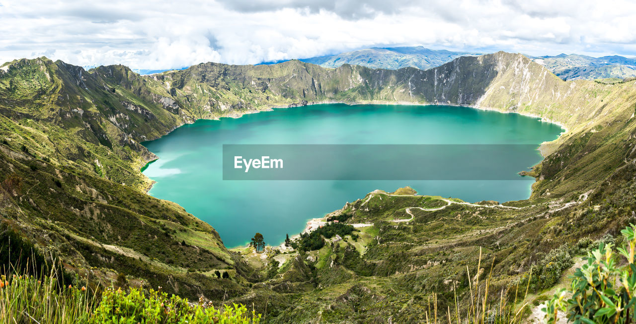 Huge and turquoise lake in quilotoa, ecuadorian andes volcanoes route