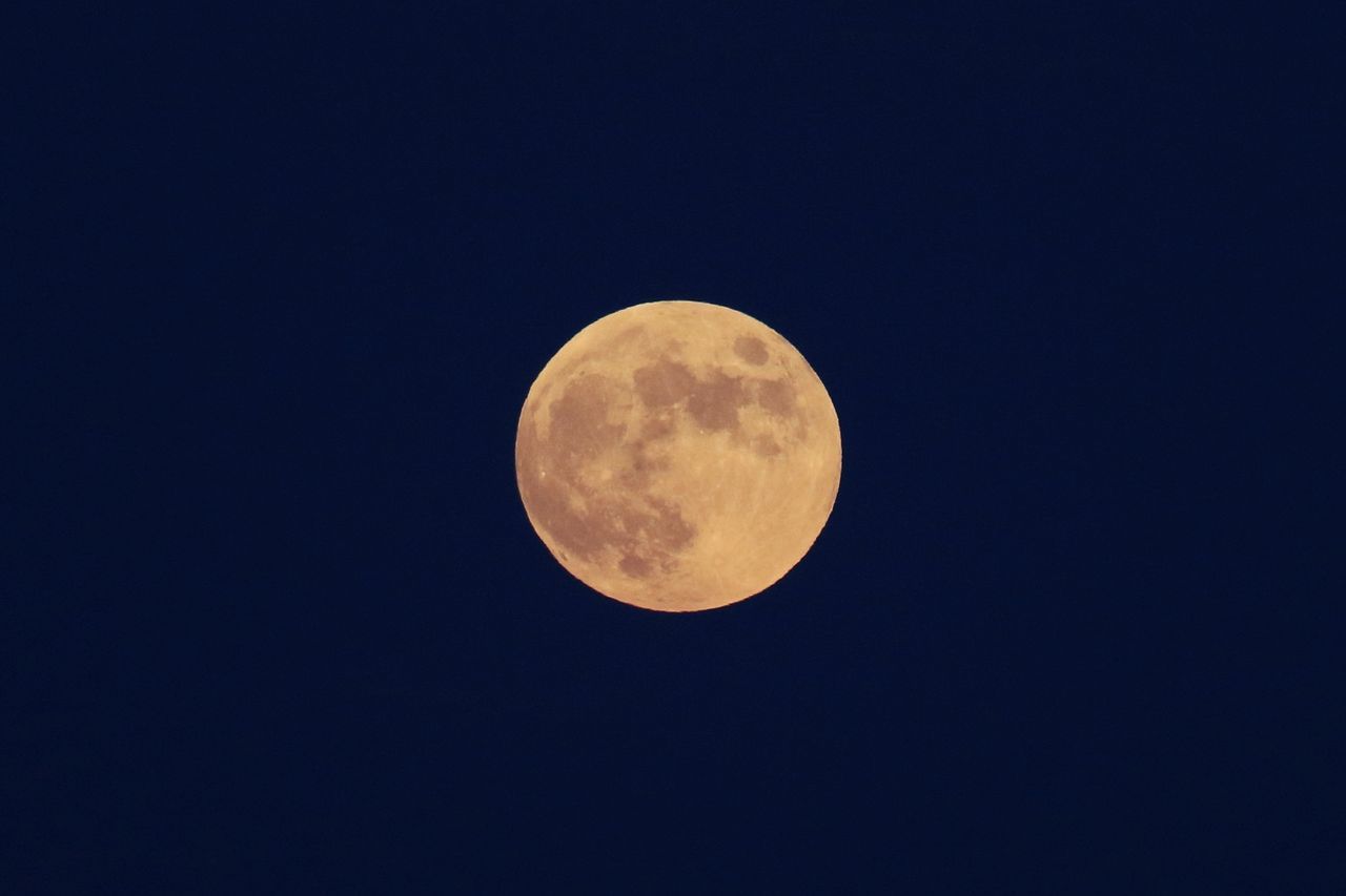 moon, sky, space, astronomy, night, full moon, beauty in nature, circle, planetary moon, geometric shape, scenics - nature, astronomical object, tranquility, no people, shape, nature, low angle view, copy space, tranquil scene, clear sky, space and astronomy, moon surface, idyllic, astrology, outdoors, science, celestial event, blue