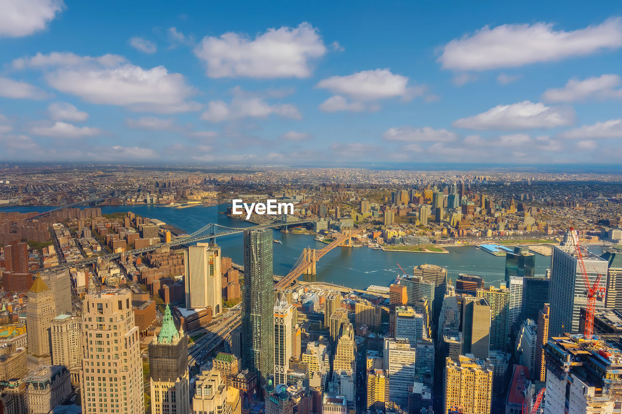 high angle view of city buildings against sky