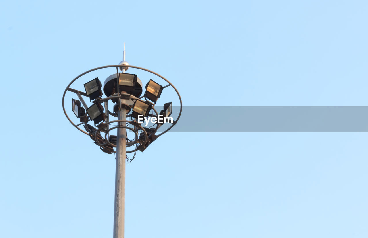 Low angle view of floodlight against clear sky