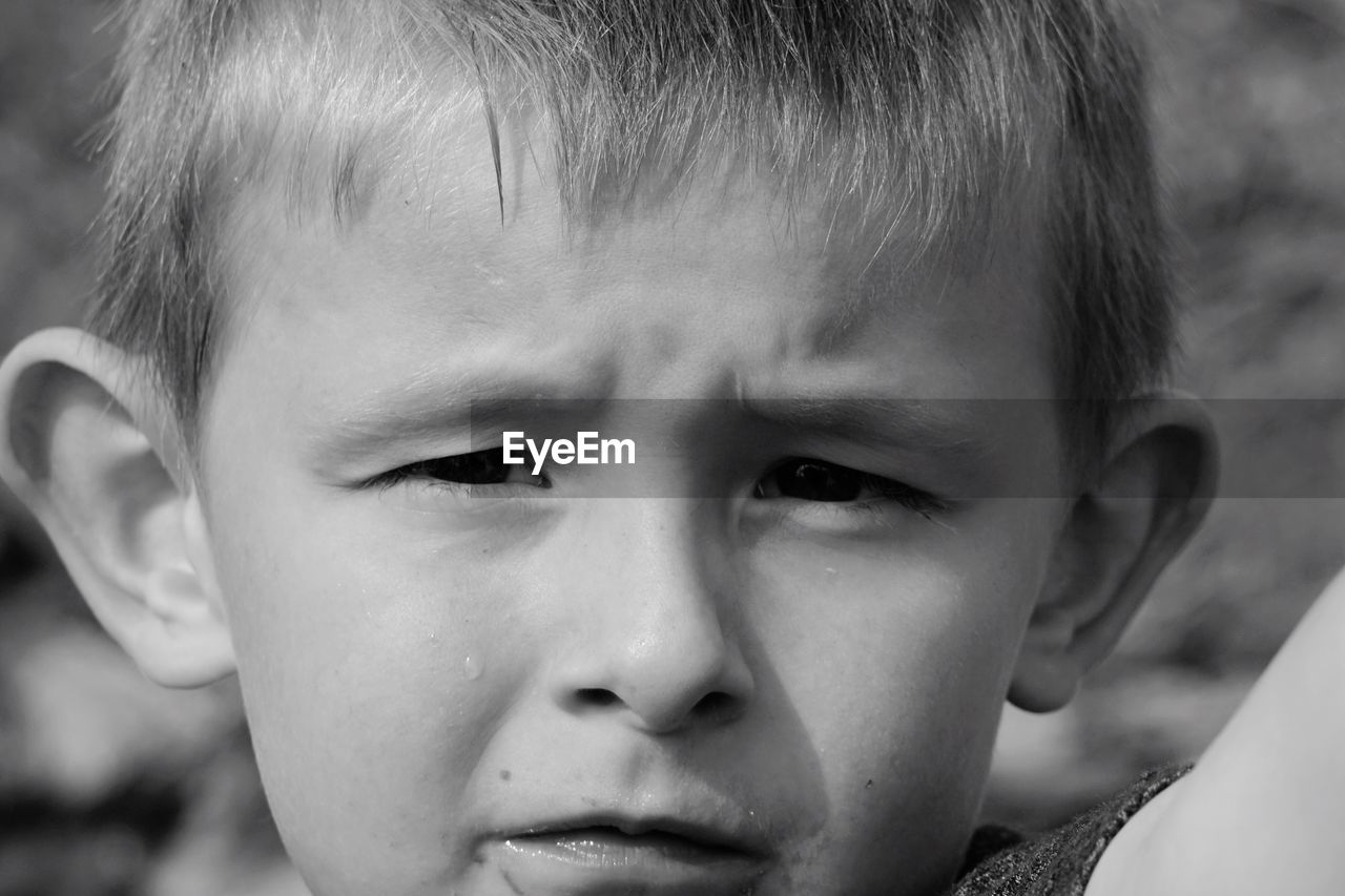 CLOSE-UP PORTRAIT OF BOY WITH EYES CLOSED