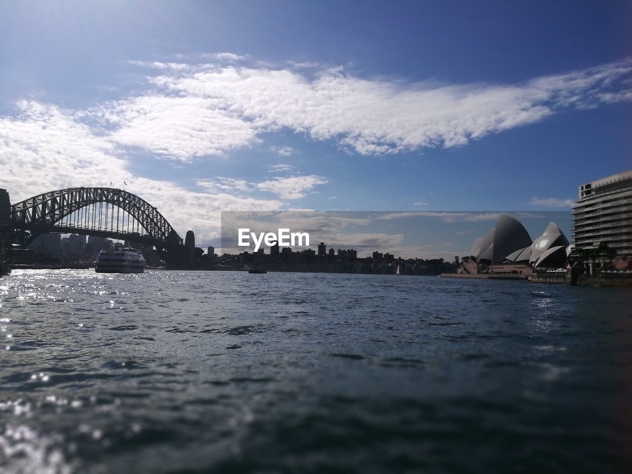 VIEW OF BRIDGE OVER RIVER IN CITY