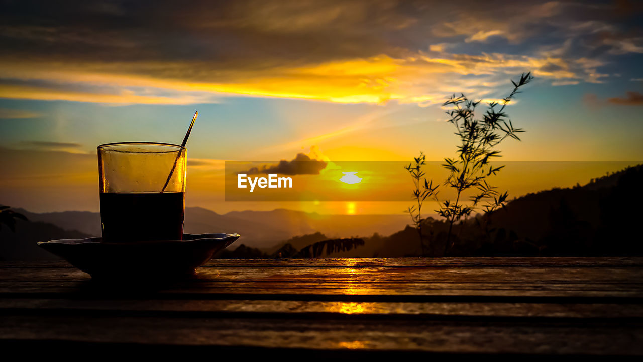 SCENIC VIEW OF ORANGE TABLE AGAINST SKY