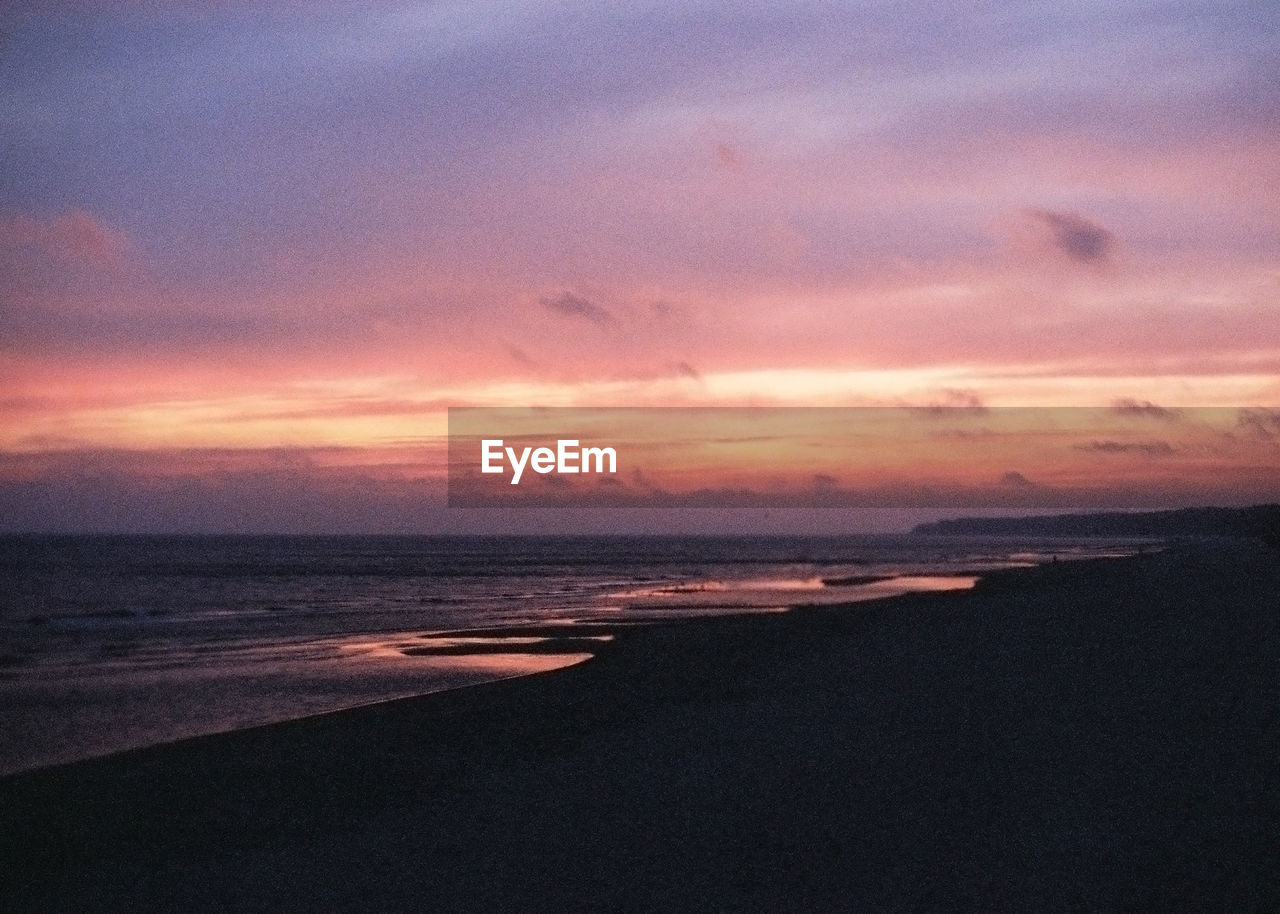 Scenic view of sea against sky at sunset