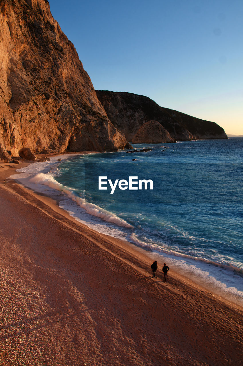 Scenic view of beach against clear sky